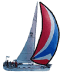 A sailboat with a red, white and blue sail.